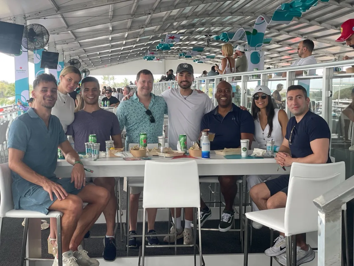 Team enjoying the Miami F1 Grand Prix hospitality lounge