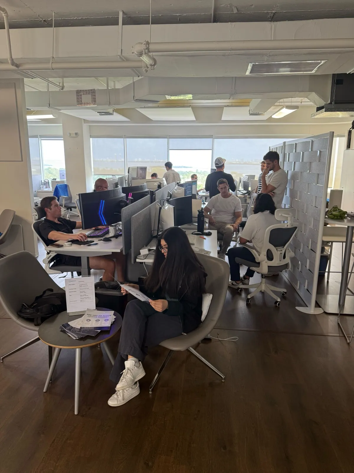 CoinRoutes team working at their desks in the office